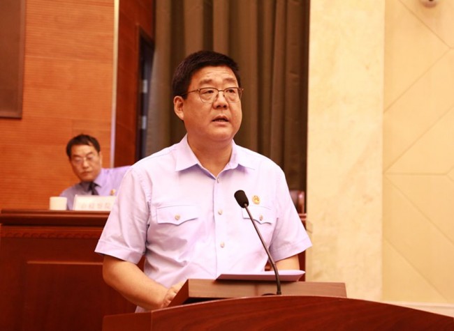 梁维院长向市人大常委会作行政审判工作报告